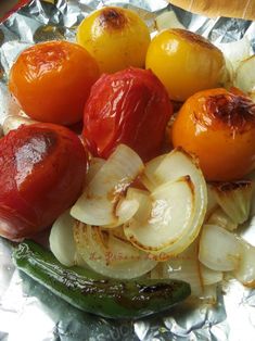 tomatoes, onions, and peppers on tin foil