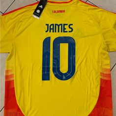 a soccer jersey with the name james 10 on it is laying on a tile floor