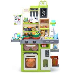 a green and white toy kitchen with lots of food