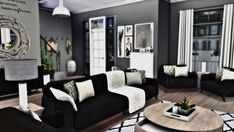 a living room filled with black and white furniture