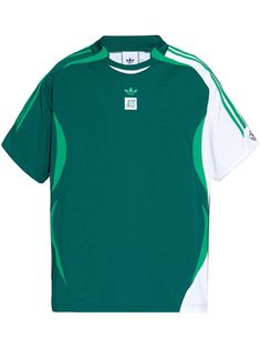 a green and white t - shirt with an adidas logo on the chestline