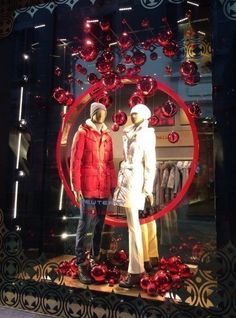 two mannequins are dressed in red and white