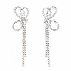 PRICES MAY VARY. 1. Design style: The design of these long tassel bow earrings is elegant and fashionable, combining long tassels and bow elements to showcase the femininity and romance of women. The addition of sparkling diamonds adds a dazzling glow, making the earrings more dazzling and glamorous. 2. Material quality: The bow earrings for women are made of high-quality materials, ensuring their durability and comfort. The high-quality material makes the earrings more comfortable to wear and l Earring Silver, Sparkly Jewelry, Long Tassel Earrings, Earrings Cute, Bow Earrings, Bow Design, Drop Earring, Silver Drop Earrings, Ribbon Bow