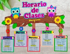 an image of a spanish class sign with owls on the branch and flowers around it