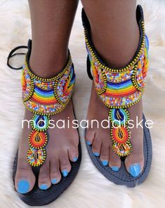 100% handmade using leather and fine beads. Masai beaded sandals are made using the pure original leather and quality African beads.They are inspired by the Masai community They are perfect for any occasion. True to size. We ship worldwide. Feel free to send me a convo for any clarifications Beaded Open Toe Barefoot Sandals For Festival, Traditional Beaded Barefoot Sandals For Party, Embellished Toe Post Festival Sandals, Embellished Toe Post Sandals For Festival, Beaded Barefoot Sandals With Single Toe Strap For Festivals, Handmade Open Heel Sandals For Summer, Bohemian Adjustable Embellished Sandals, Embellished Open Toe T-strap Sandals For Summer, Bohemian Embellished Adjustable Sandals