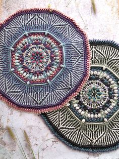 two circular rugs sitting on top of a cement floor