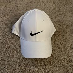 White Nike Legacy Fit Hat, Tried On But Never Worn Out, Like New Condition Without Tags Nike Baseball Cap, One Size Fits Most, Nike Snapback Hats For Spring, Nike Cap For Spring, Nike Spring Cap, Classic Nike Baseball Cap, White Baseball Cap For Golf, Classic White Visor Hats, Nike White Hat With Curved Brim, Nike White Curved Brim Hat