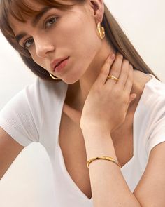 Select this eroded bangle bracelet for an effortless yet contemporary style, ideal for those who love a two-toned pattern fashioned into a subversive-basic design. Elevate your look with a casual and cool piece, perfect for any occasion.
Band Width: 5.5mm
Band Thickness: 3mm
Material: 18k Gold & Rhodium Plated Everyday Tarnish Resistant Cuff Bangle, Gold Plated Bangle Cuff Bracelet, Gold Plated Bangle Cuff Bracelet For Everyday, Minimalist Tarnish Resistant Cuff Bracelet, Elegant Hoop Cuff Bracelet For Everyday, Modern Hoop Bangle For Everyday Wear, Modern Hoop Bangle For Everyday, Fine Jewelry Everyday Bangle Bracelet, Minimalist Everyday Gold Plated Cuff Bracelet