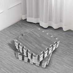 the floor is made out of books and has been placed on top of each other