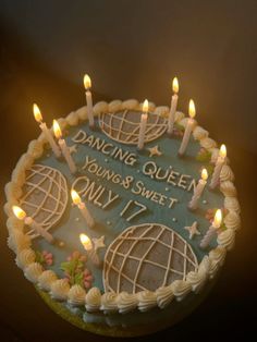 a cake with candles on it that reads dancing queen young & sweet only 17