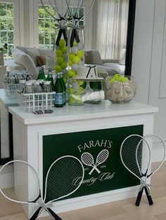 a table with tennis rackets and balls on it