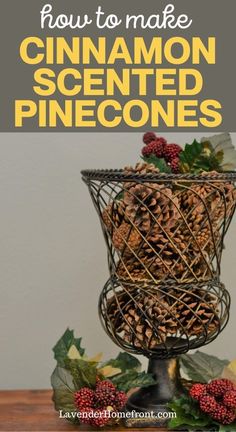 a wire basket filled with pine cones on top of a wooden table