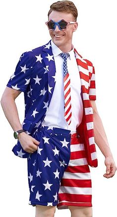 a man dressed in an american flag suit and sunglasses, with his hands on his hips