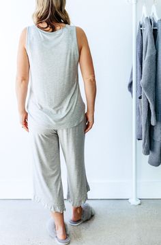 This luxury two piece loungewear set is cozy, comfortable & buttery. soft. Wear as pajamas or loungewear. Made from silky-soft sustainable bamboo for all the comfort. Our sleepwear looks elegant, feels luxurious and is cooling, phenomenally soft, and ultra-comfortable. Cropped jogger bottoms feature a pretty ruffle hem detail making them the perfect length for any height. A drawstring waist tie allows adjustment for just the perfect fit. Matching tank with small pocket makes an adorable pair. Re Two Piece Loungewear, Bamboo Pajamas, Gifts For Your Sister, Cropped Joggers, Loungewear Set, Bamboo Fabric, Drawstring Pants, Sleepwear Women, Waist Tie