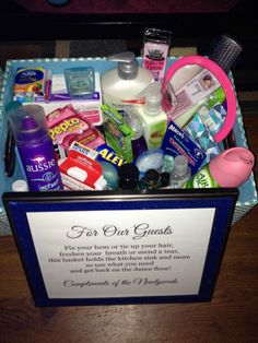 a blue box filled with personal care items on top of a wooden table next to a sign