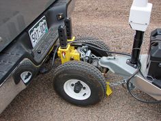 the back end of a golf cart with its wheels and suspensions attached to it