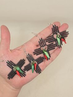 These New Mexico Zia earrings come with a set of a red and green chile.   The Zias are hand poured and left to set.  Once set, glass chiles are added, finishing with nickel free hooks. Green Chile, New Mexico, Hand Poured, Jewelry Earrings Dangle, Etsy Earrings, Dangle Drop Earrings, Dangle Earrings, Jewelry Earrings, Drop Earrings