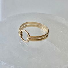 Two bands of heavy 14 gauge wire was hammered and forged to a 8mm gold filled circle. This double band ring is both delicate and bold. Select from gold band as shown, bright sterling silver, or mixed metal. Choose from sizes 4-10. Try stacking these with the other rings. View the rest of the ring collection below: http://www.etsy.com/shop/BellatrinaJewelry?section_id=11006644 ** Follow us for updates, contests, and promos. :) www.facebook.com/BellatrinaJewels www.twitter.com/BellatrinaJewel Gold Circle Ring, Double Band Ring, Stackable Rings Wedding, Double Band Rings, Gold Rings Stackable, Gold Circle, Ring Collection, Circle Ring, Gold Filled Ring