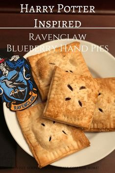 harry potter inspired blueberry hand pies on a white plate with the words harry potter inspired