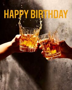 two people toasting and holding glasses filled with alcohol, while the words happy birthday are in