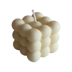 a bunch of white balls sitting on top of each other in front of a white background