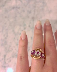 Metal: 14K Yellow And White Gold Stone: Diamond And Ruby Shape: Round Approximate Diamond Total Weight: .32 Carats Approximate Ruby Weight: .61 Carats Ring Size: 6 Sizable: Yes. Please state size in size/personalization box if needed. Weight of entire piece with stones: 4.70 grams Measurements of Top Part Of Ring: 13 mm Long Circumference Of Flower: 7 mm and 8 mm Shank Tappers Down To: 2 mm Original Listed Price: $825 Matching Earrings: https://www.etsy.com/listing/508483667/14k-ruby-and-diamond Yellow Gold Multi-stone Cluster Ring, Purple Ruby Ring With Diamond For Anniversary, Heirloom Style Brilliant Cut Ruby Ring, Gold Cluster Ruby Ring For Anniversary, Yellow Gold Ruby Ring For Anniversary, 14k Stamped Ruby Ring, Diamond And Ruby Ring, Amethyst And Diamond Ring, Diamond Flower