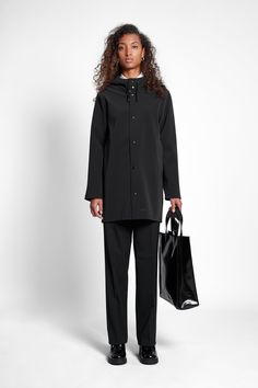 Stockholm Matte Raincoat Black | STUTTERHEIM US Black Weatherproof Raincoat For Work, Black Weatherproof Workwear Raincoat, Modern Black Hooded Raincoat, Black Hooded Raincoat For Work, Waterproof Hooded Parka For Workwear, Waterproof Hooded Parka For Work, Hooded Weatherproof Raincoat For Work, Workwear Raincoat With Adjustable Hood, Liquid Laundry Soap