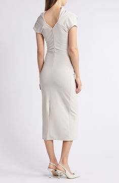 Whether you're off to the office or your next cocktail party, this stretch-enhanced sheath dress has you covered. Back zip closure Boat neck Short sleeves Unlined 90% polyester, 10% spandex Dry clean Made in the USA Beige Knee-length Bodycon Evening Dress, Beige Bodycon Dress For Formal Occasions, Beige Sheath Bodycon Dress For Evening, Beige Sheath Bodycon Evening Dress, Beige Midi Bodycon Dress For Evening, Elegant Beige Bodycon Dress For Work, Beige Knee-length Bodycon Dress For Formal Events, Beige Knee-length Bodycon Dress For Formal Occasions, Beige Sheath Bodycon Dress For Formal Occasions