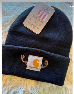 a beanie hat with an american flag on the front and a tag attached to it