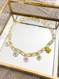 "The Florence necklace is a statement piece!  Handcrafted with our 24k gold filled large paperclip chain and seed bead daisy charms! 17\" L. Clasp closure." Seed Bead Daisy, Bead Daisy, Flower Charm Necklace, Daisy Charm, Color Flower, Flower Charm, Paper Clip, Seed Bead, Florence