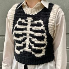 a person wearing a knitted skeleton sweater