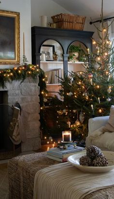 a living room filled with furniture and a christmas tree in front of a fire place