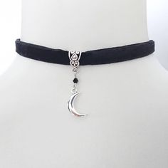 A small 3D bi-convex silver metal Crescent Moon on a black double sided super soft velvet choker. Detailed with a tiny black glass bicone faceted bead. Moon charm measures 15x10 mm Circumference is adjustable from 32 to 38 cm (approx) Width of velvet choker is 1 cm. Lunar Witch, Gothic Choker, Gothic Chokers, Velvet Choker, Moon Charm, Fantasy Jewelry, Faceted Bead, Alchemy, Soft Velvet