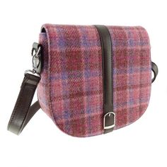 Harris Tweed 'Beauly' Shoulder Bag This smart and sophisticated Harris Tweed Shoulder Bag from Glen Appin is called the Beauly. Since it is made from genuine Harris Tweed it will last you forever. We Scots call Harris Tweed 'The Big Cloth' because of its incredible durability. In addition, the flap features a center strap and buckle along with a magnetic fastener button to ensure your items are secure. Along with an adjustable/detachable shoulder strap, its perfect for everyday. The inside of th Tweed Purse, Tweed Handbag, Tweed Bag, Scottish Jewellery, Purple Heather, Inside Bag, Small Crosses, Harris Tweed, Purple Bags