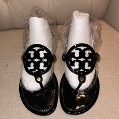 Euc Size 9 Black Tory Burch Best Seller Miller Patent Leather Sandal Please See Photos For Condition Of Shoes. The Iconic Sandal With A Cult Following. Our Original Miller Is Loved For Its Timeless Style And Exceptional Comfort. The Classic Design Has A Lightly Cushioned Footbed With Topstitching And Laser-Cut Logo With Hand-Painted Edges Fastened By Gold Rivets. The Original Fit, Our Most Narrow Miller. Footbed Is 55mm Wide At Instep. Runs Slightly Small, We Recommend Ordering ½ Size Up If You Are Between Sizes Patent Leather Napa Leather Lining On Underside Of Straps Smooth Leather Toe Post Flexible Rubber Sole Tory Burch Shoes, Best Seller, Timeless Style, Smooth Leather, Women's Shoes Sandals, Leather Sandals, Patent Leather, Classic Design, Tory Burch