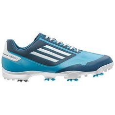 a blue and white adidas soccer shoe with spikes on the bottom, in front of a