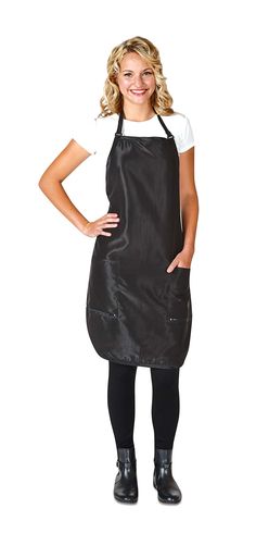 a woman in an apron posing for the camera