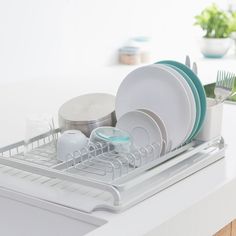 the dish rack is full of clean dishes