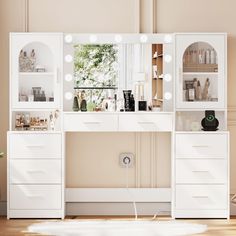 a white vanity with lights on it in front of a mirror and shelves filled with cosmetics