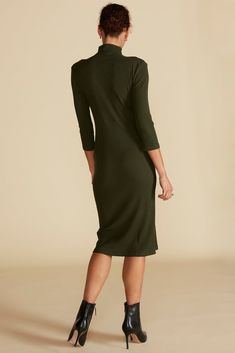 As functional as it is chic, this rib-knit midi dress has a fitted silhouette to contour your curves and 3/4 sleeves for arm coverage. Complement the versatile black shade with gold jewelry. DESIGN- Slim fit. Size up for a more relaxed look.- A mock neck, body-con style featuring 3/4 sleeves, asymmetrical button detail, and a midi length.- Silver shank buttons- Length: 42 1/2" FABRIC & CARE- Made from our signature Paris Rib, a stretchy-soft fabric. - 96% LENZING™ Modal, 4% Spandex- Non-toxic d Chic Solid Color Half Sleeve Midi Dress, Chic Stretch Midi Dress With Half Sleeves, Fitted Midi Dress With 3/4 Sleeves For Fall, Elegant Stretch Mid-length Bodycon Dress, Elegant Mid-length Stretch Bodycon Dress, Chic Midi Dress With 3/4 Sleeves For Date Night, Chic Solid Midi Dress With 3/4 Sleeves, Chic Solid Color Midi Dress With 3/4 Sleeves, Elegant Fall Half Sleeve Midi Dress