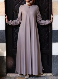 Easy Care Flared Abaya Acorn color asked for it, and we are happy to oblige: Finally, a wrinkle-resistant version of our popular abayas! The name says it all, and it’s as easy to wear as it is to care for. Elasticized sleeves, a front opening, and the perfect flattering, feminine flair work together to create one beautiful, practical piece you’ll be reaching for day after day. Solid Long Sleeve Dresses For Eid, Latest Abaya, Abaya Style