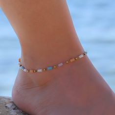 This beaded chain anklet is for women. Its boho style makes it a great piece of beaded summer jewelry. The ankle bracelet has an extension so the size can be adjusted. Adjustable Beaded Chain Anklets For Summer, Gold Anklets With Tiny Beads For Beach, Gold Anklets With Colorful Beads For Summer, Bohemian Multicolor Beaded Chain Anklets, Beaded Anklets For The Beach, Colorful Beads Anklet For Festival, Summer Gold Beads Bracelets For Beach, Gold Beaded Strand Anklets, Bohemian Beaded Chain Anklets For Festivals