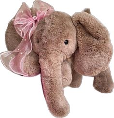 an elephant stuffed animal with a pink bow on its head