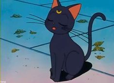 a black cat sitting on top of a tile floor next to leaves in the air