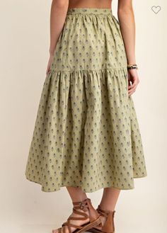 The Ruth Flower Print Midi Skirt is beautiful shade of Pistachio green. It is a two tiered skirt long skirt with a bunched hem. It is made of 100% cotton. This skirt belongs to a matching cropped shirt, but this skirt can be paired with any top whether you want to style it more causal or for a work environment. This elegant midi skirt would be perfect for a warm autumn night. Small 4-10 Medium 10-12 Large 12-14 Pistachio Color, Blue Zone, Tiered Midi Skirt, Printed Midi Skirt, Green Print, Plus Size Tops, Long Skirt, Everyday Outfits, Midi Length