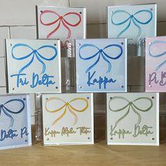 six different colored cards with the words happy birthday written on them and tied in ribbons