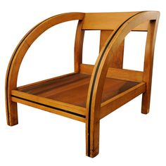 a wooden chair with curved arms and legs