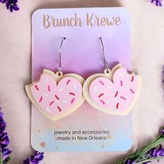 Introducing our adorable Heart Sugar Cookie earrings! These charming earrings are designed to look like miniature heart-shaped sugar cookies, complete with frosting, sprinkles, and even a bite taken out of the side. Lightweight and comfortable, they are perfect for everyday wear or special occasions where you want to express your love for all things cute and delicious. Whether you're a baking enthusiast or simply appreciate unique accessories, these Heart Sugar Cookie earrings are a delightful a Sweet Dangle Heart Earrings For Gifts, Cute Heart Earrings For Birthday, Sweet White Heart Earrings, Cute Pink Heart Earrings For Birthday, Sweet White Heart Earrings For Valentine's Day, Cute Hypoallergenic Heart Earrings, Sweet Heart-shaped Earrings For Gift, Sweet Heart Earrings For Valentine's Day, Cute Nickel-free Heart Earrings For Valentine's Day