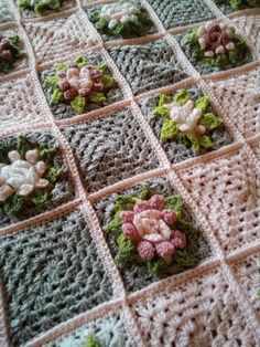 a crocheted blanket with flowers on it