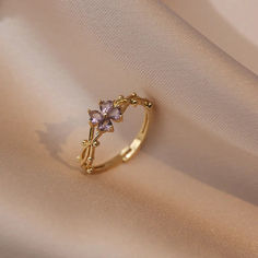 Fashionable French Violet Adjustable Ring – Light Luxury Micro-Inlaid Stainless Steel Floral-Inspired Jewelry for Women Add a touch of whimsical charm to your daily style with our Fashionable French Violet Open-ended Adjustable Ring, designed with a delightful mini flower vibe. Crafted from premium stainless steel with intricate micro-inlays, this light luxury ring offers both elegance and a playful floral aesthetic. Its adjustable fit ensures comfort for everyday wear, making it the perfect acc Cute Promise Rings, Pretty Engagement Rings, Clover Ring, Cute Engagement Rings, French Retro, Gold Ring Designs, Jewelry Accessories Ideas, Jewelry Lookbook, Fancy Jewelry